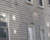 Melted vinyl siding caused by reflected sunlight - Structure Tech Home ...